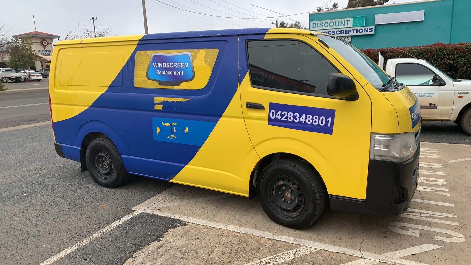 The signwritten van parked in Griffith, with the second Griffith Mobile Windscreens ute behind it
