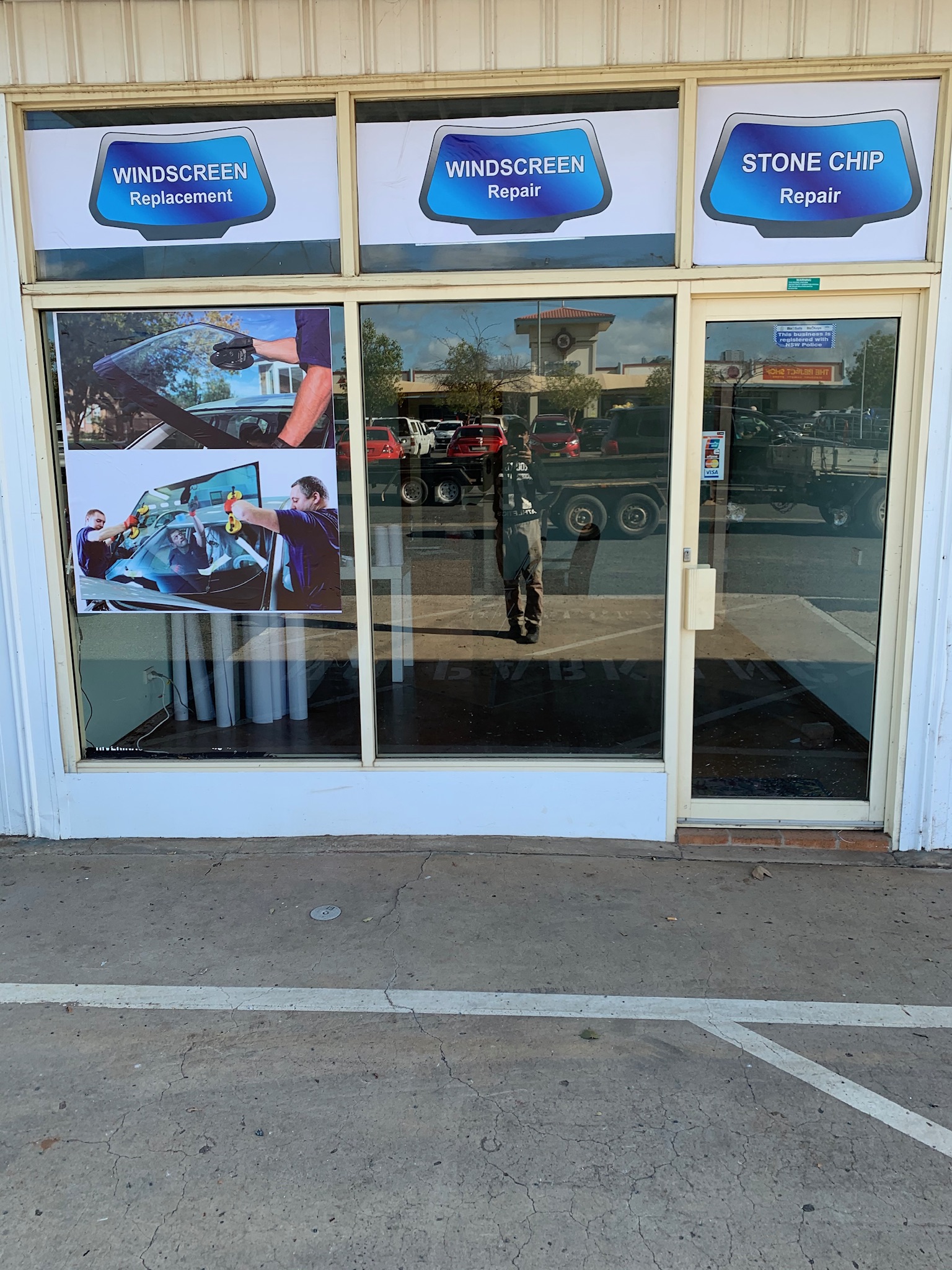 The workshop window at Bonegilla Road, with the windscreen replacement, windscreen repair and stone chip repair signs above it